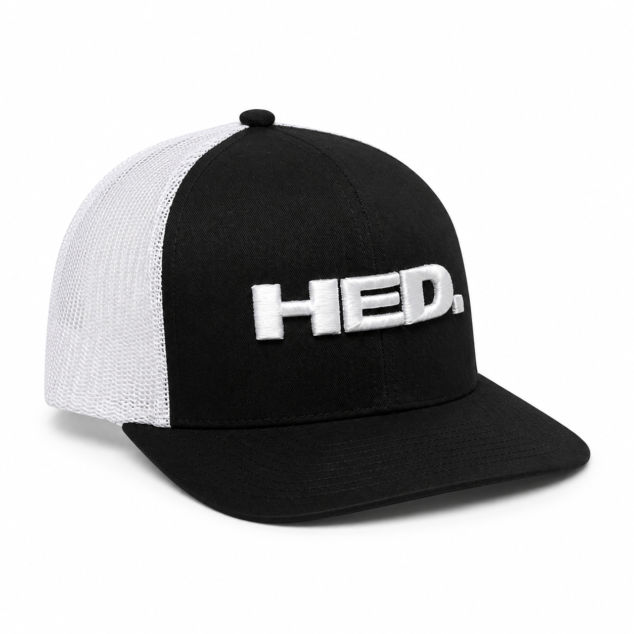 The HED. Trucker Snapback Hat – Black & White features a black and white mesh design, an adjustable snapback closure, and a curved bill. The front panel displays “HED.” in large, raised white letters.