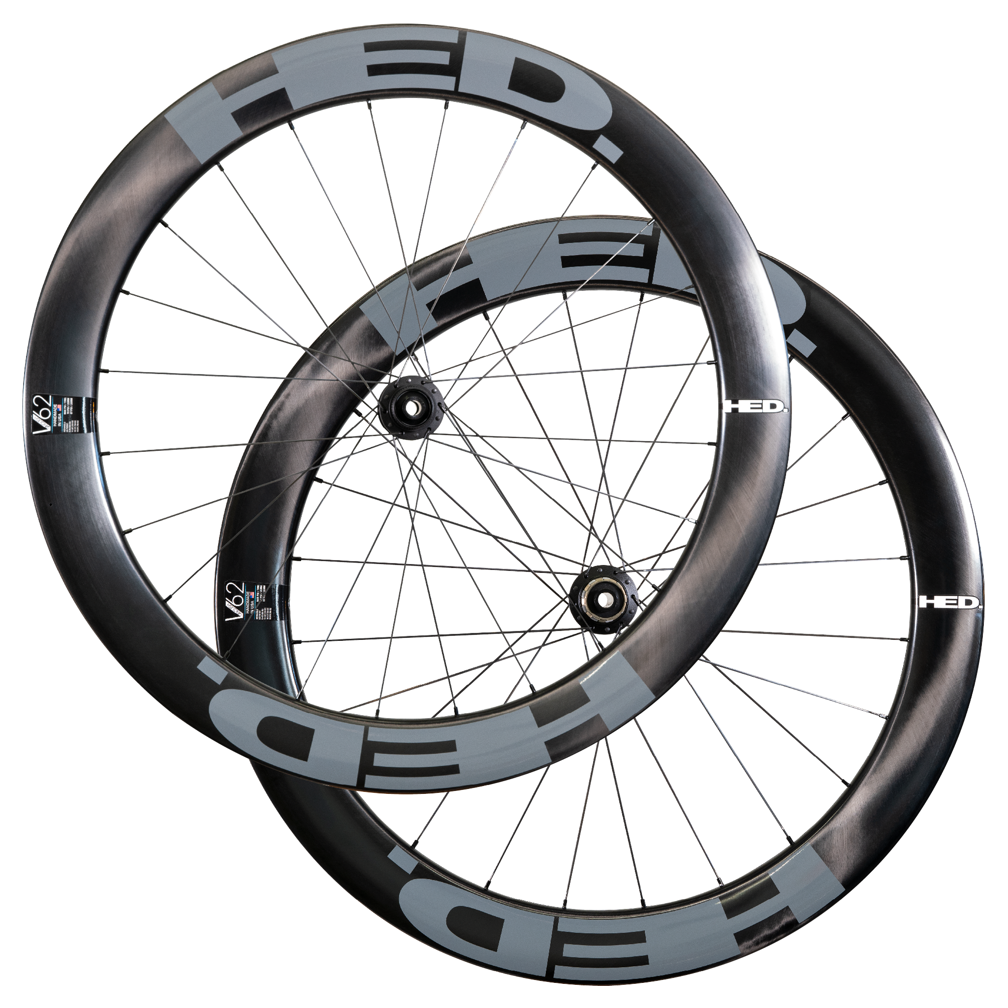 Two HED Vanquish V62 Carbon Aero Wheels in black and gray, featuring deep-section, aerodynamic carbon rims, are shown overlapping against a plain white background—an ideal high-performance wheelset for triathlon riders.