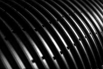 close-up of black HED bicycle rims arranged in rows